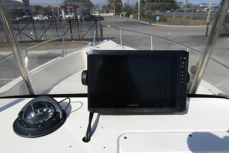 Slide: The Image of 2004 Key West Center Console boat dashboard with Garmin GPS and compass. - 17