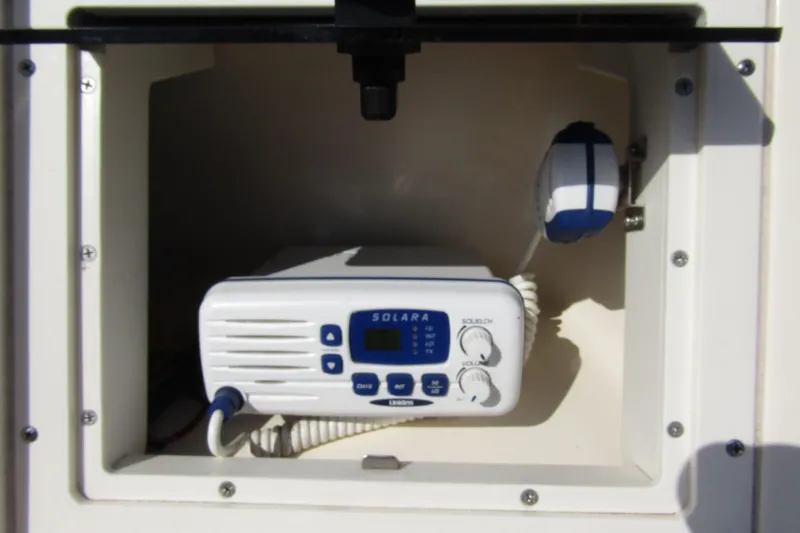 Slide: The Image of Marine radio in a 2004 Key West 2020 Center Console boat compartment. - 19