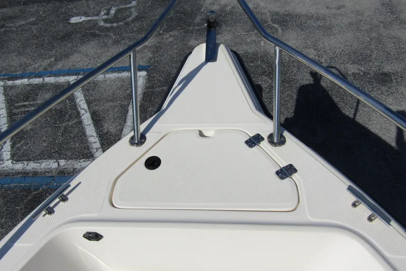Slide: The Image of Bow of 2004 Key West Center Console boat with stainless steel railings. - 7