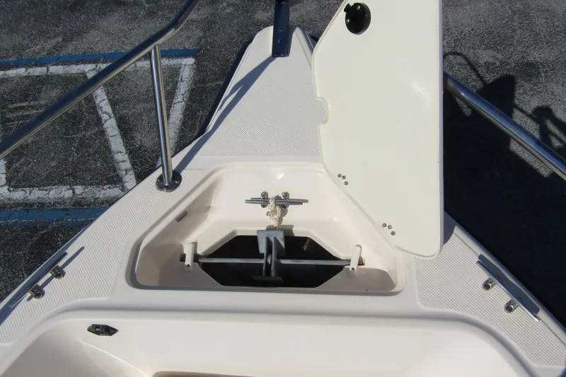 Slide: The Image of Open anchor compartment on 2004 Key West Center Console boat. - 8