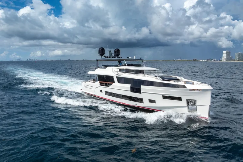 The Image of Luxurious 2021 Sirena 88 yacht cruising on open sea under cloudy skies. - 0