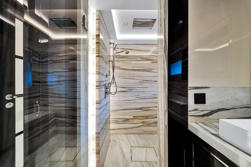 Slide: The Image of Luxurious marble bathroom interior on a 2021 Sirena 88 yacht, featuring modern shower design. - 103