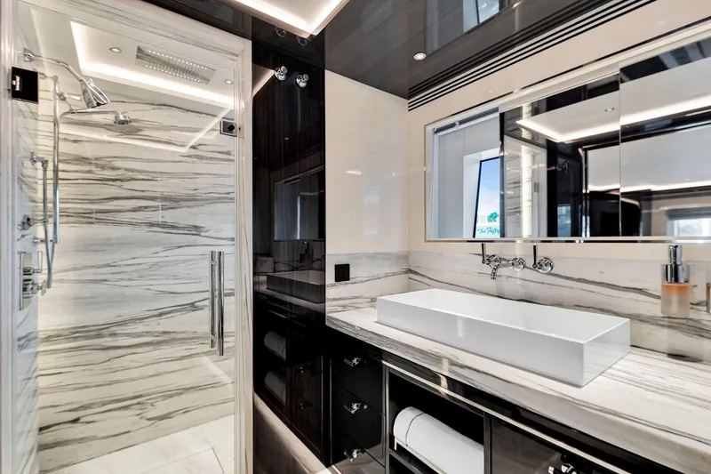 Slide: The Image of Luxurious bathroom in 2021 Sirena 88 yacht with marble accents and modern fixtures. - 131