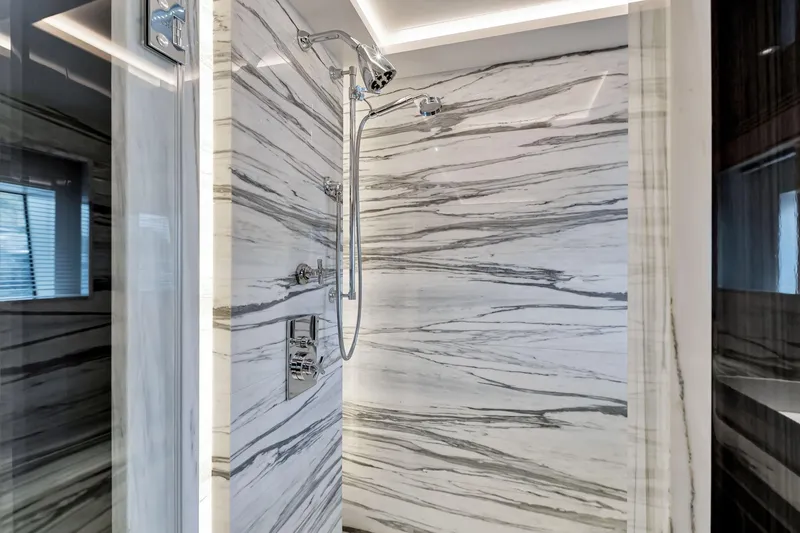 Slide: The Image of Luxurious marble shower in 2021 Sirena 88 yacht, featuring sleek chrome fixtures. - 132