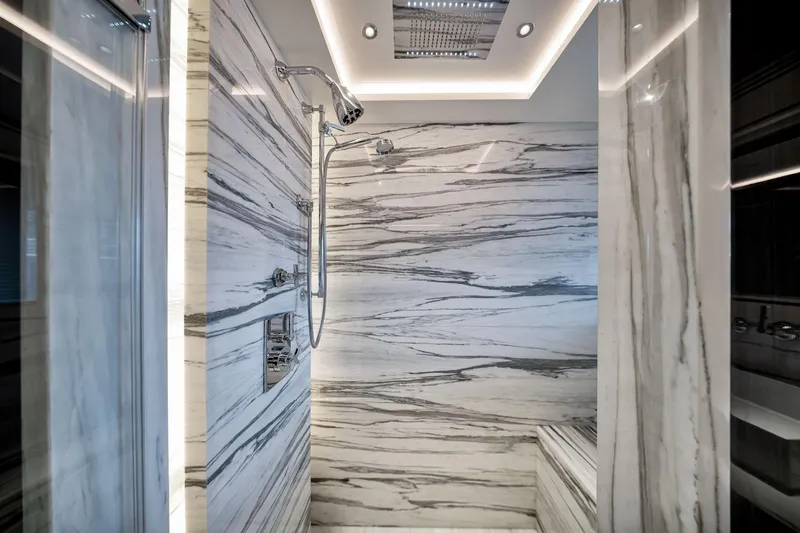 Slide: The Image of Luxurious marble shower interior on the 2021 Sirena 88 yacht. - 133