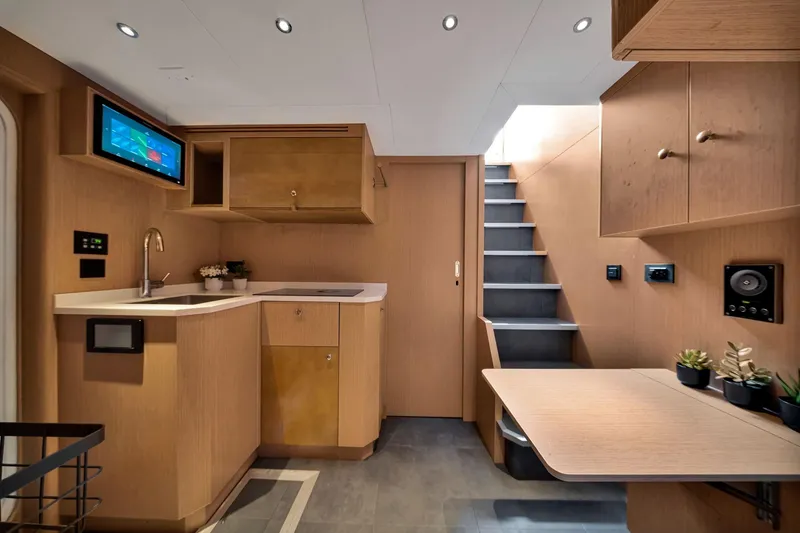 Slide: The Image of Modern interior of 2021 Sirena 88 yacht with sleek kitchen and staircase design. - 134