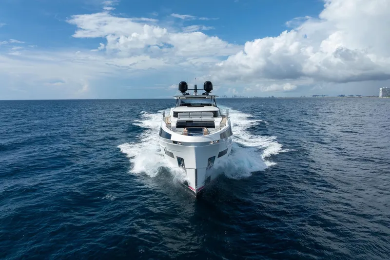Slide: The Image of Luxury Sirena 88 yacht cruising on open sea under blue sky, 2021 model. - 144