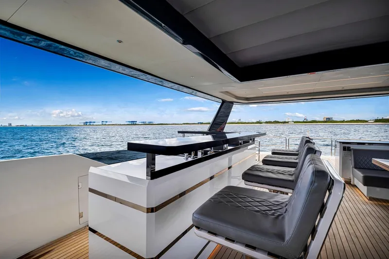 Slide: The Image of Luxurious 2021 Sirena 88 yacht deck with sleek seating and ocean view. - 21