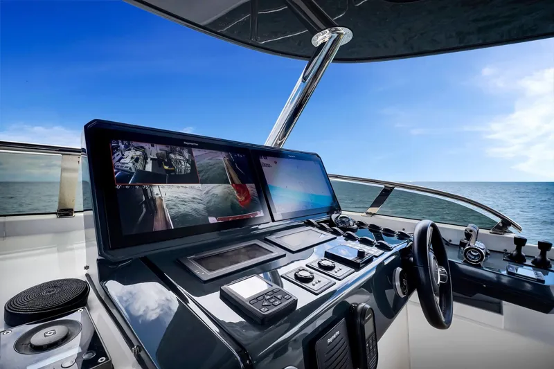 Slide: The Image of Modern helm of 2021 Sirena 88 yacht with advanced navigation systems, ocean view. - 26