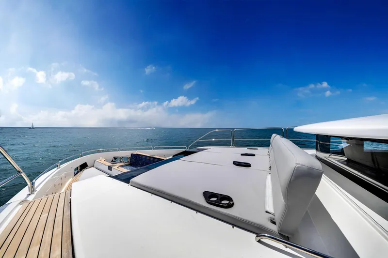 Slide: The Image of Luxurious 2021 Sirena 88 yacht deck with ocean view under clear blue sky. - 34