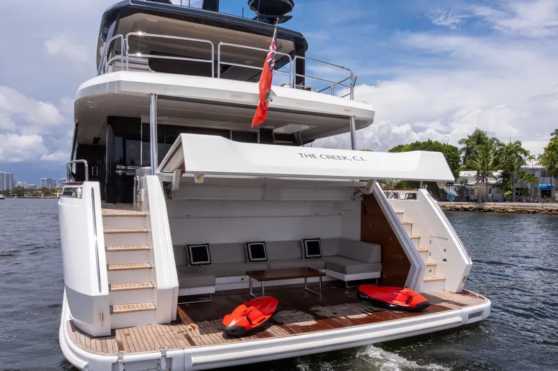 Slide: The Image of Luxury Sirena 88 yacht, 2021 model, with open deck and water sports equipment. - 38