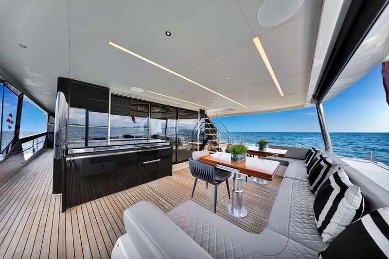 Slide: The Image of Luxurious 2021 Sirena 88 yacht interior with elegant seating, ocean view, and modern design. - 43
