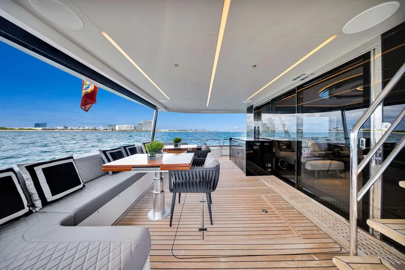 Slide: The Image of Luxurious 2021 Sirena 88 yacht deck with elegant seating and ocean view. - 46