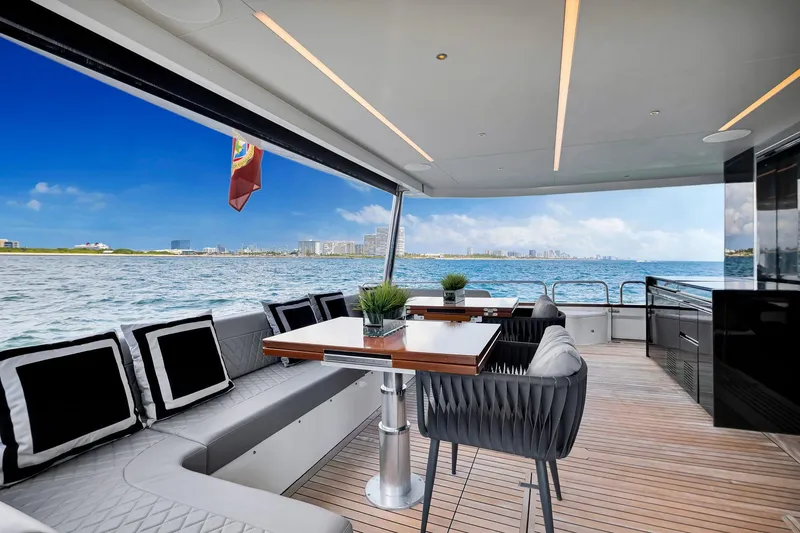 Slide: The Image of Luxurious 2021 Sirena 88 yacht deck with elegant seating and ocean view. - 48