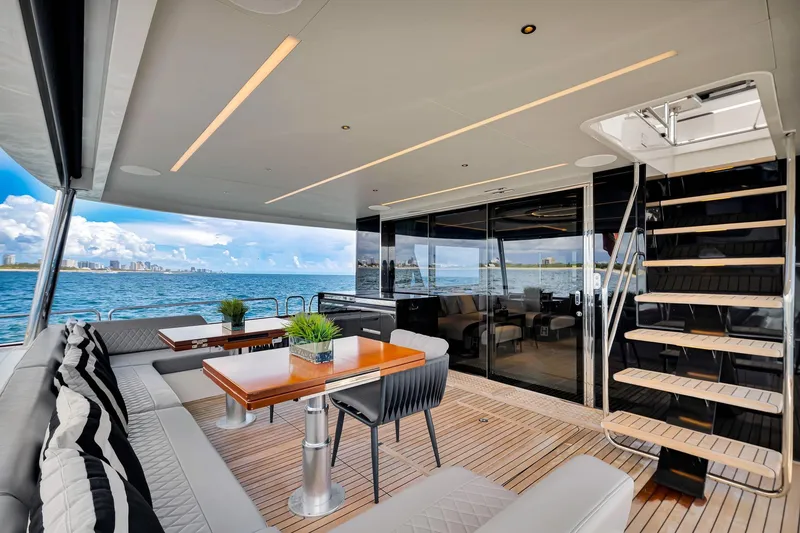 Slide: The Image of Luxurious 2021 Sirena 88 yacht deck with elegant seating and ocean view. - 49