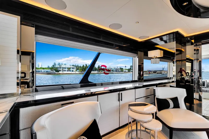 Slide: The Image of Luxurious interior of 2021 Sirena 88 yacht with waterfront view through large windows. - 54