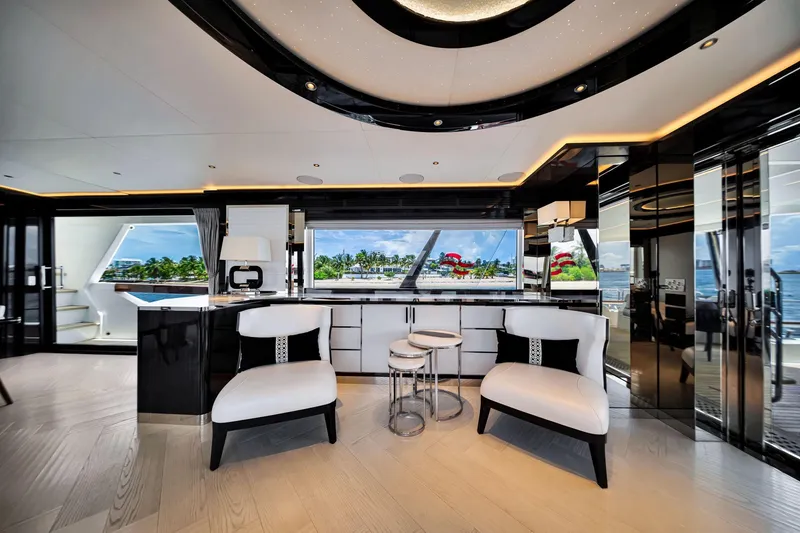Slide: The Image of Luxurious interior of 2021 Sirena 88 yacht with modern seating and panoramic windows. - 56