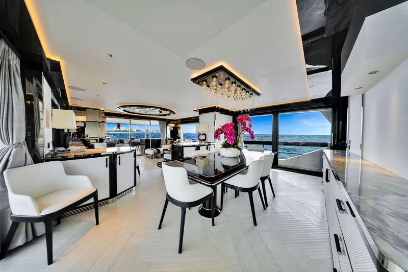Slide: The Image of Luxurious interior of 2021 Sirena 88 yacht with ocean view and elegant dining area. - 62