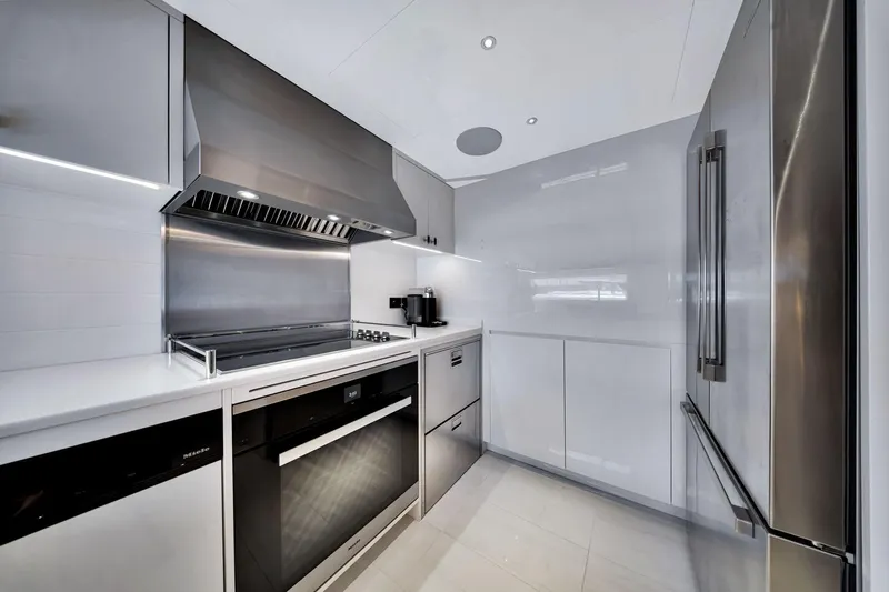 Slide: The Image of Modern kitchen interior on 2021 Sirena 88 yacht, featuring sleek stainless steel appliances. - 65