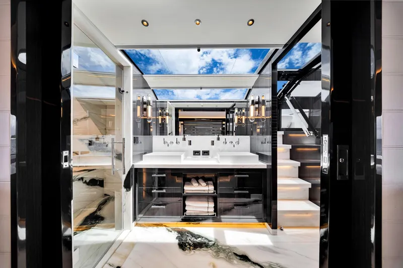 Slide: The Image of Luxurious bathroom interior on 2021 Sirena 88 yacht, featuring modern design and skylight. - 81