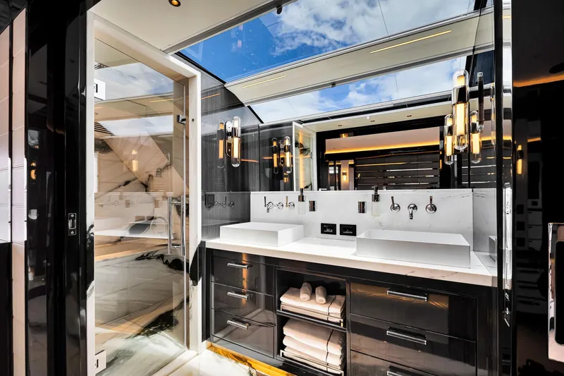 Slide: The Image of Luxurious bathroom interior on 2021 Sirena 88 yacht with modern fixtures and skylight. - 82