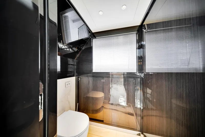 Slide: The Image of Luxurious bathroom interior on a 2021 Sirena 88 yacht, featuring sleek design and modern fixtures. - 84