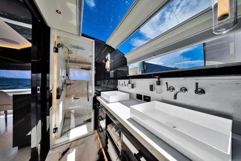 Slide: The Image of Luxurious bathroom interior on 2021 Sirena 88 yacht with ocean view and modern fixtures. - 85