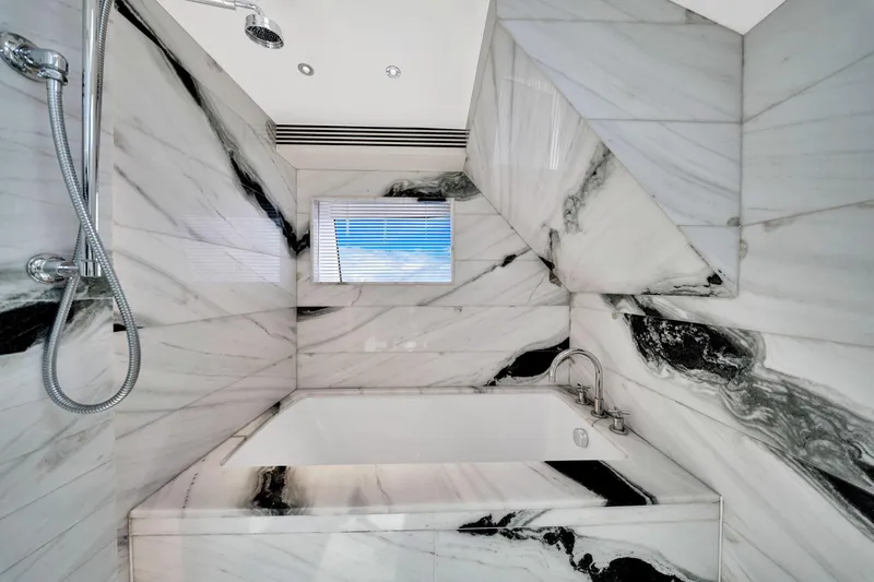 Slide: The Image of Luxurious marble bathroom in 2021 Sirena 88 yacht, featuring elegant black and white design. - 86