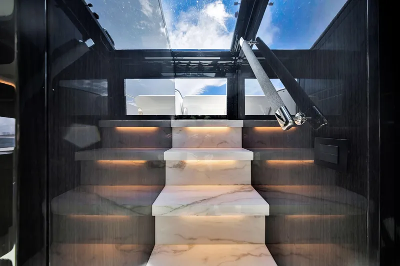 Slide: The Image of Luxurious marble staircase with ambient lighting on a 2021 Sirena 88 yacht. - 88