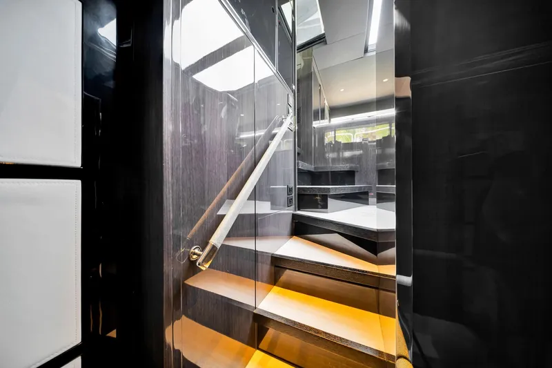 Slide: The Image of Luxurious interior staircase of 2021 Sirena 88 yacht with modern design and ambient lighting. - 89