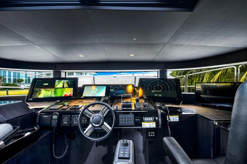 Slide: The Image of Modern helm of 2021 Sirena 88 yacht with advanced navigation systems and sleek design. - 92