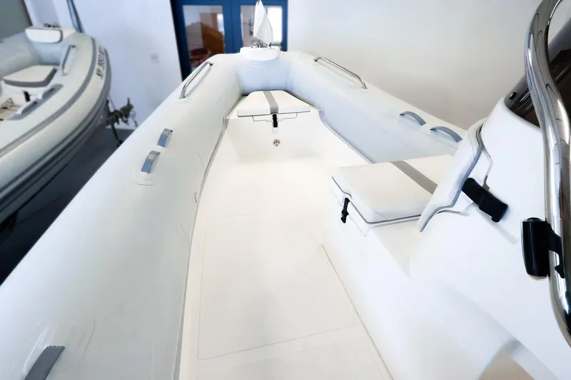 Slide: The Image of 2022 AB Inflatables Oceanus 17 VST boat interior with white seating and sleek design. - 14
