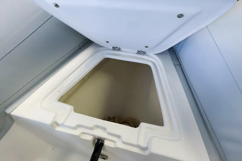 Slide: The Image of Open storage compartment on 2022 AB Inflatables Oceanus 17 VST boat. - 19