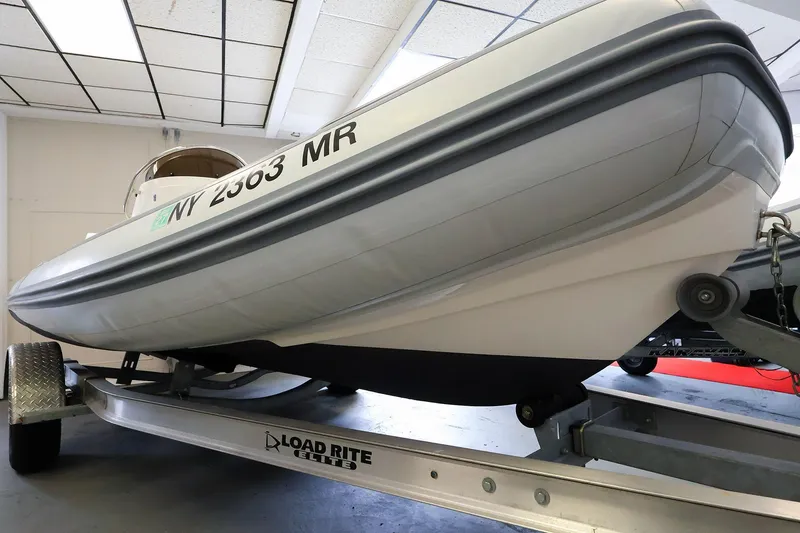 Slide: The Image of 2022 AB Inflatables Oceanus 17 VST boat on Load Rite trailer indoors. - 22