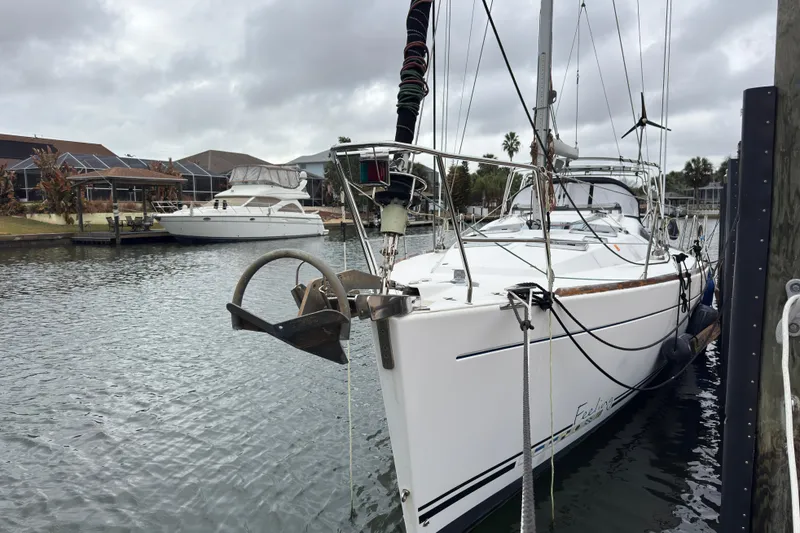 The Image of 2004 Alliaura FEELING 44 DI sailboat docked in a marina, overcast sky. - 0