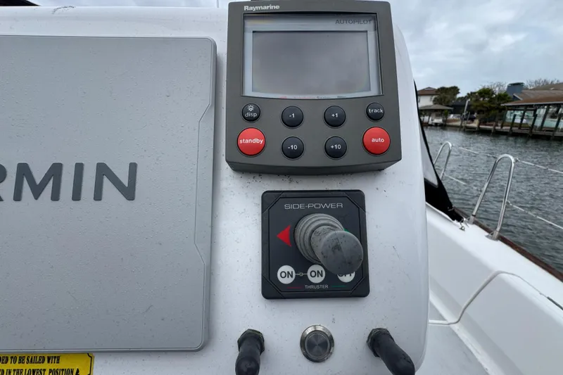 Slide: The Image of Control panel of a 2004 Alliaura FEELING 44 DI yacht with Garmin and Raymarine devices. - 15