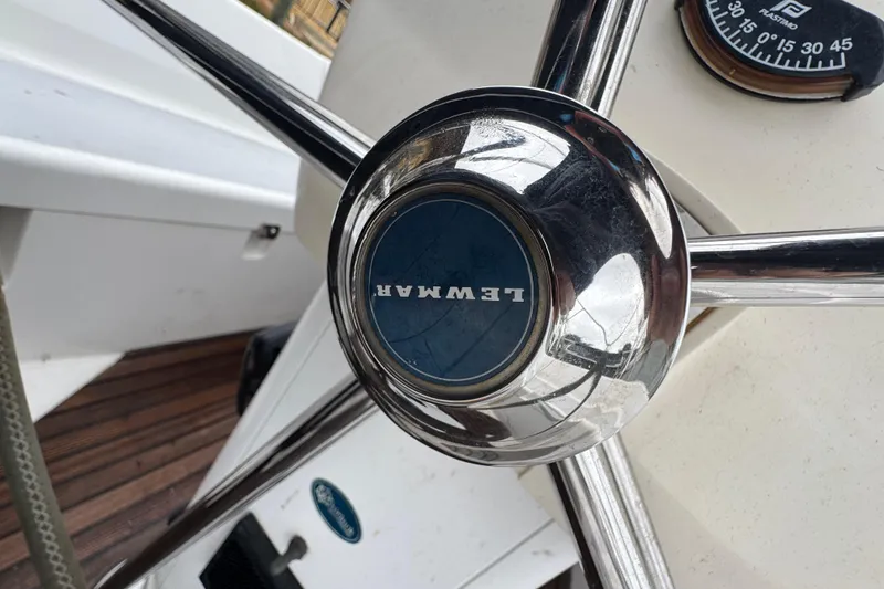 Slide: The Image of Steering wheel of 2004 Alliaura FEELING 44 DI sailboat with Lewmar branding. - 19