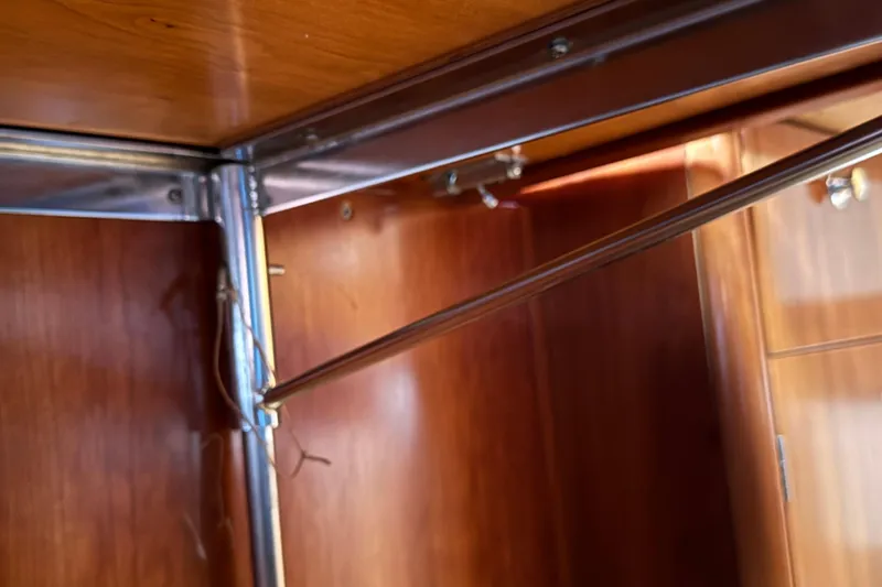 Slide: The Image of Interior view of 2004 Alliaura FEELING 44 DI sailboat with wooden cabinetry and metal fixtures. - 32