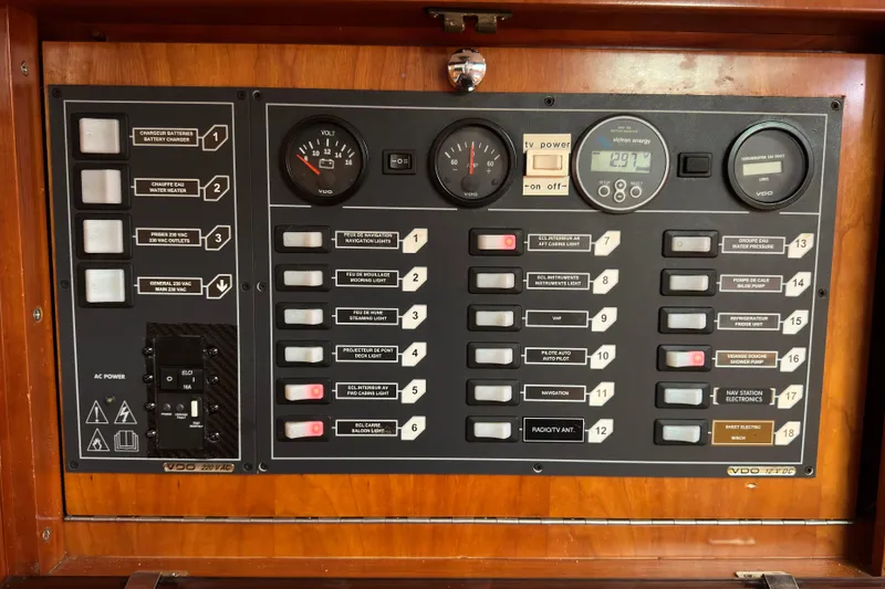 Slide: The Image of Control panel of a 2004 Alliaura FEELING 44 DI sailboat with various switches and gauges. - 38