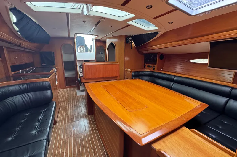 Slide: The Image of Luxurious interior of 2004 Alliaura FEELING 44 DI yacht with wood finish and leather seating. - 42