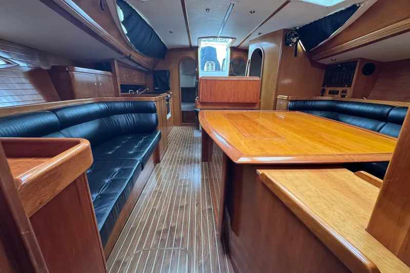 Slide: The Image of Luxurious interior of 2004 Alliaura FEELING 44 DI yacht with wooden finishes and leather seating. - 44