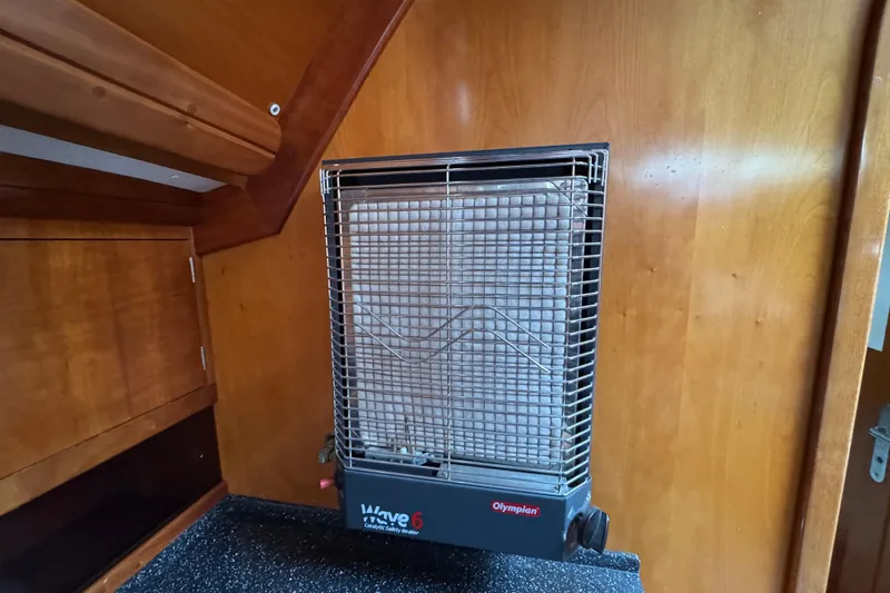 Slide: The Image of Catalytic heater inside 2004 Alliaura FEELING 44 DI yacht, mounted on wooden wall. - 54