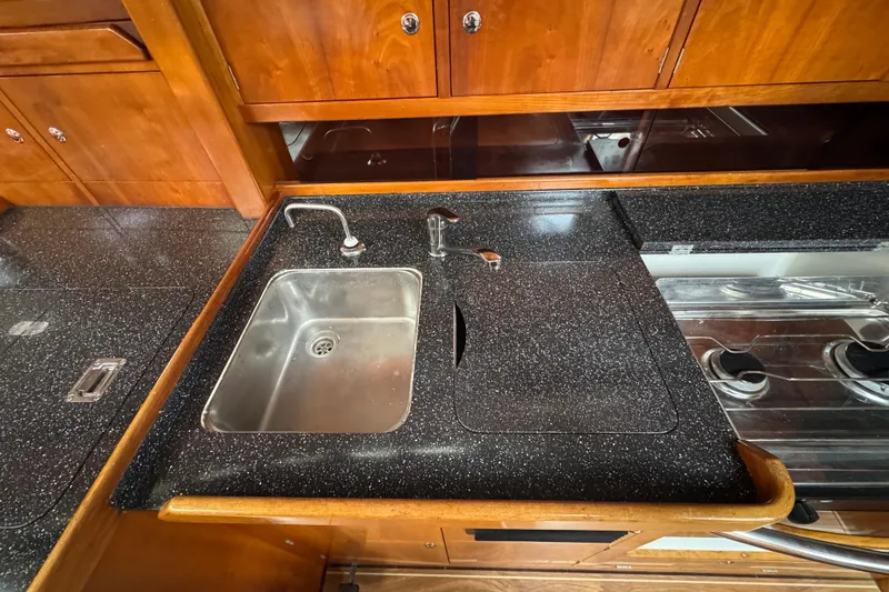 Slide: The Image of 2004 Alliaura FEELING 44 DI yacht kitchen with sink and stove. - 56