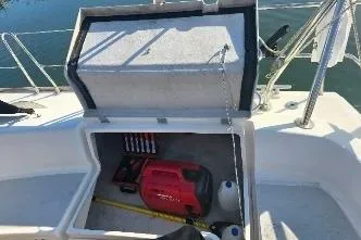 Slide: The Image of Open storage compartment on 2004 Feeling 44 DI sailboat with generator and supplies. - 58