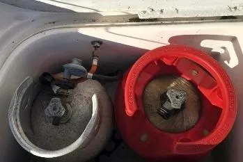 Slide: The Image of Two gas cylinders in a storage compartment, Feeling 44 DI, 2004 model. - 59