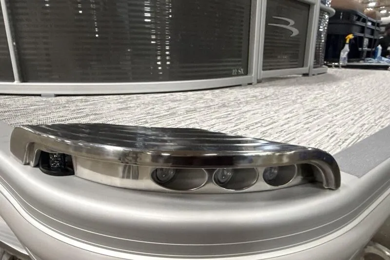 Slide: The Image of 2026 Bennington 22SXSR pontoon boat with sleek metallic detailing and modern design. - 10