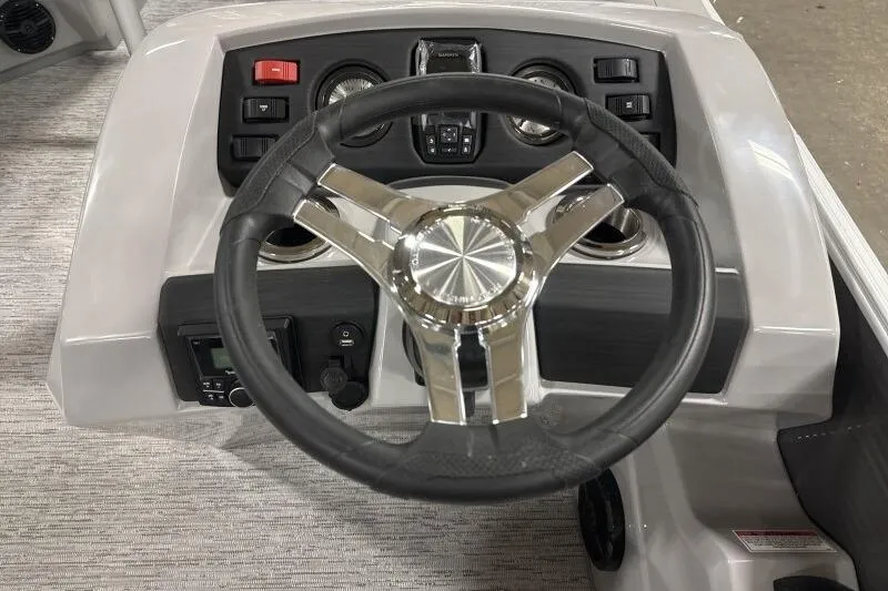 Slide: The Image of Steering wheel and dashboard of 2026 Bennington 22SXSR boat. - 7