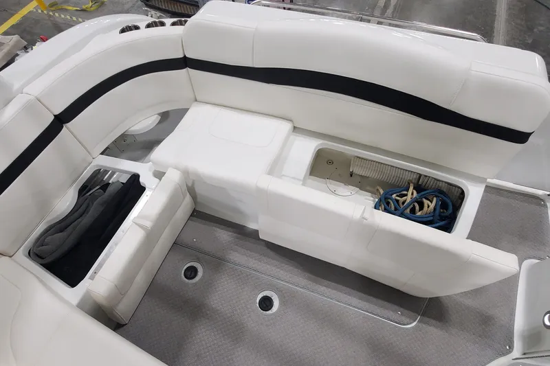 Slide: The Image of 2010 Formula 31 Performance Cruiser interior with white seating and storage compartments. - 14