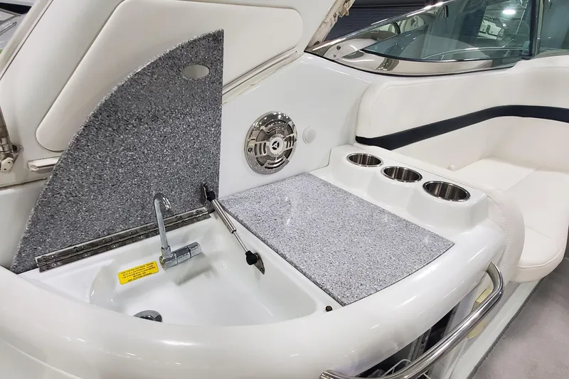 Slide: The Image of 2010 Formula 31 Performance Cruiser interior with sink, countertop, and cup holders. - 17
