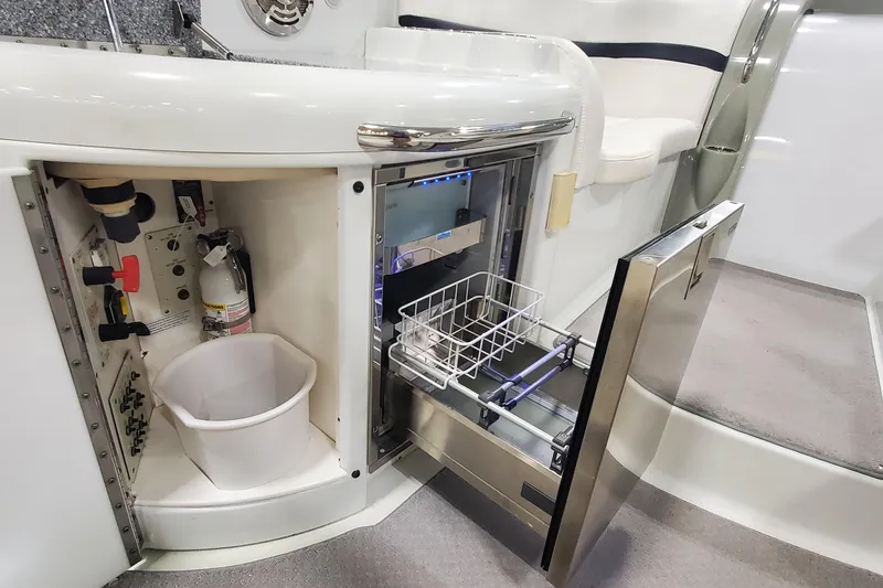 Slide: The Image of 2010 Formula 31 Performance Cruiser interior with open storage and appliance compartments. - 18